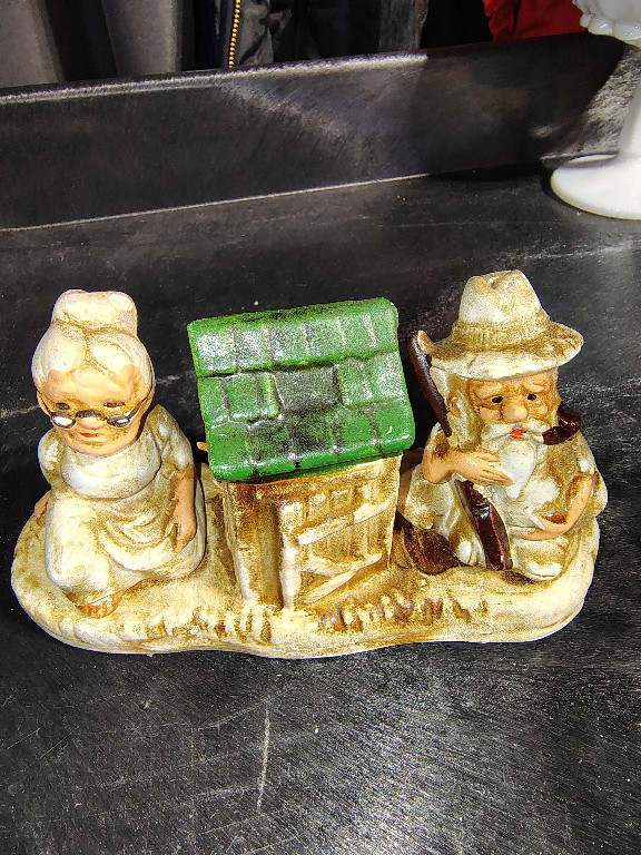 Ceramic salt and pepper shaker set featuring hillbilly couple with outhouse