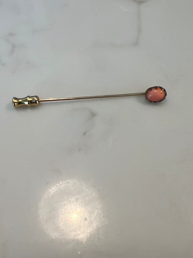 Gold stick pin with coral cabochon