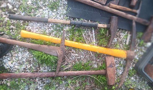 Vintage steel axe or hatchet with wooden handle