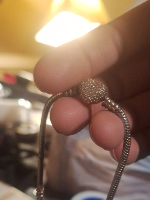 Sterling silver charm bracelet with sparkling pavé heart clasp by Pandora