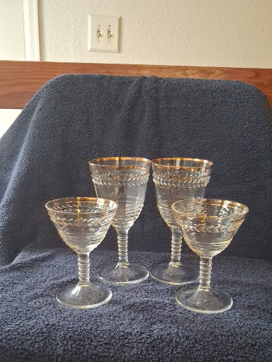 Set of four pressed glass wine glasses with gold rim trim and laurel leaf etched pattern by Federal Glass Company