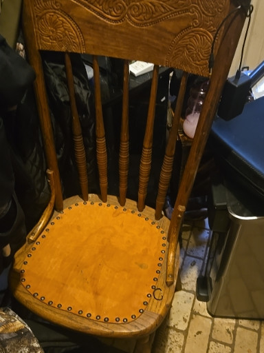 Oak pressed-back chair with tooled leather seat