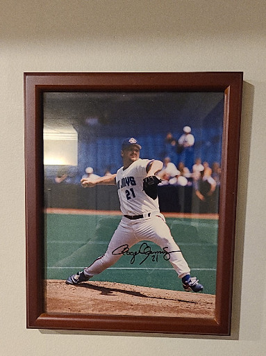 Autographed photograph of baseball player in action, framed