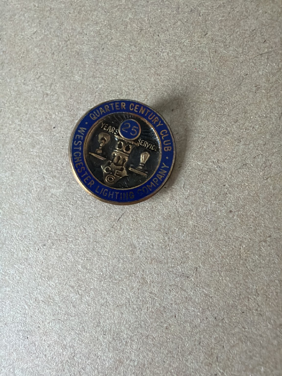 Metal lapel pin from the Boston Quarter Century Club for Lighting Industry service