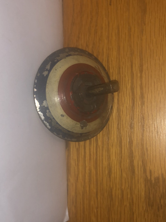 Vintage painted tin spinning top toy