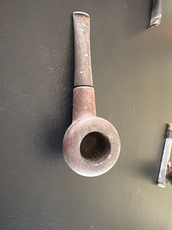 Antique clay tobacco pipe with long stem