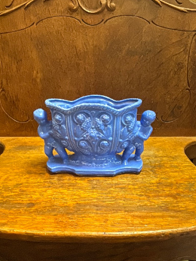 Ceramic planter with cherub handles in periwinkle blue glaze