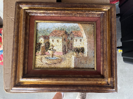 Oil painting on canvas depicting a European village or market scene with buildings and fountain, signed Ardis Viola