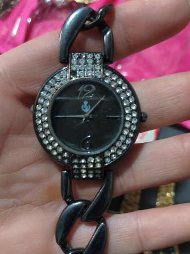 Black metal watch with rhinestone bezel titled 'Caviar' by Premier Designs