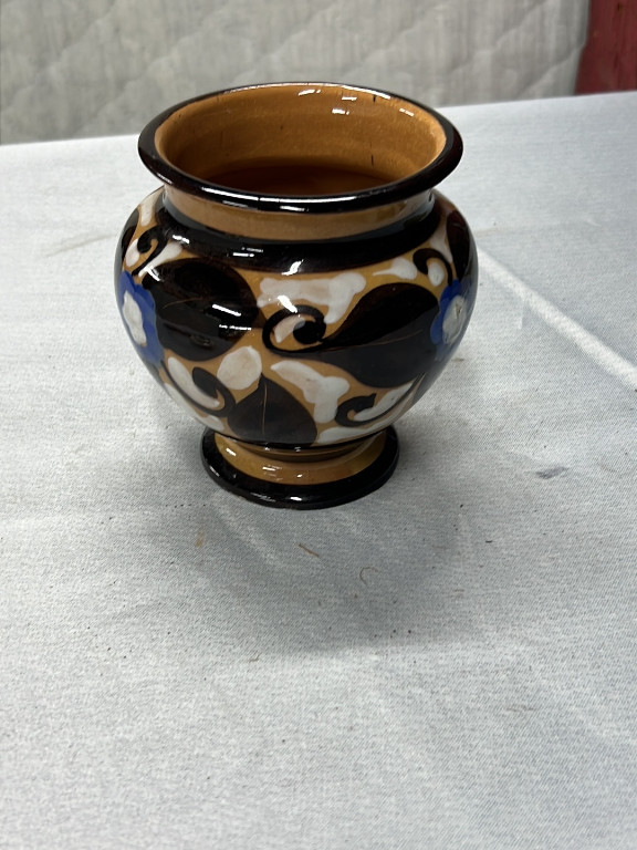 Ceramic vase with Art Deco-style geometric decoration in blue, black, tan, and white