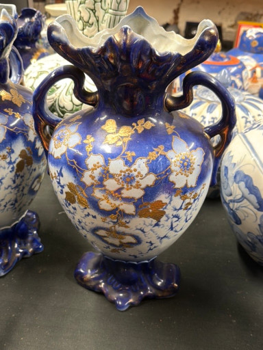 Cobalt blue porcelain vase with gold overlay floral decoration and ornate handles