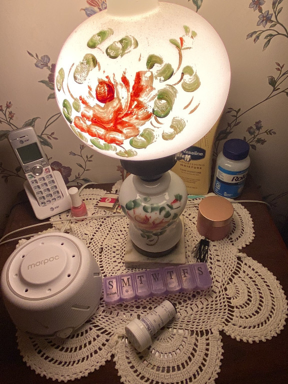 Hand-painted milk glass hurricane lamp with floral motif