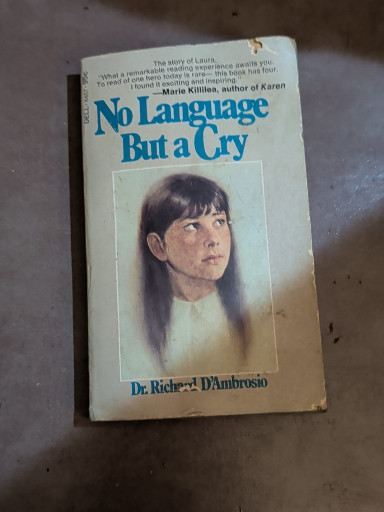Paperback book titled 'No Language But a Cry' by Dr. Richard D'Ambrosio