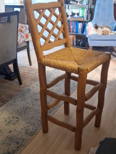 Wooden counter-height stool with woven rush seat and lattice backrest