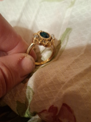 Reproduction of a Victorian-era gold ring with oval sapphire and pearls