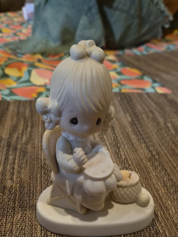 Porcelain figurine titled 'Mother Sew Dear' by Precious Moments