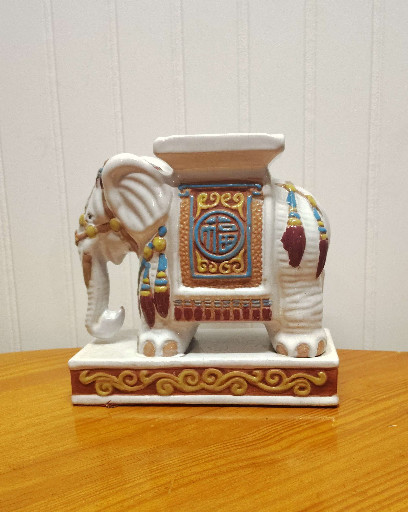 Ceramic elephant plant stand with hand-painted polychrome decoration in Hollywood Regency style