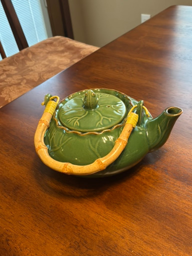 Ceramic teapot with lotus leaf design and frog lid by Stringers