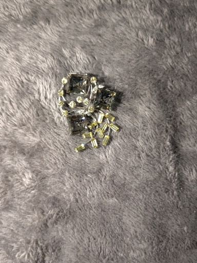 Sterling silver flower brooch with clear rhinestones by Vandell Sterling