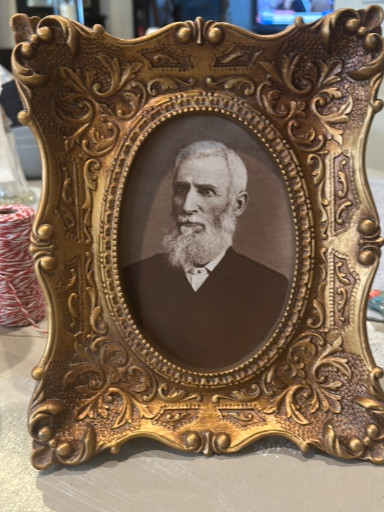 Ornate gilt wood frame with vintage photograph portrait
