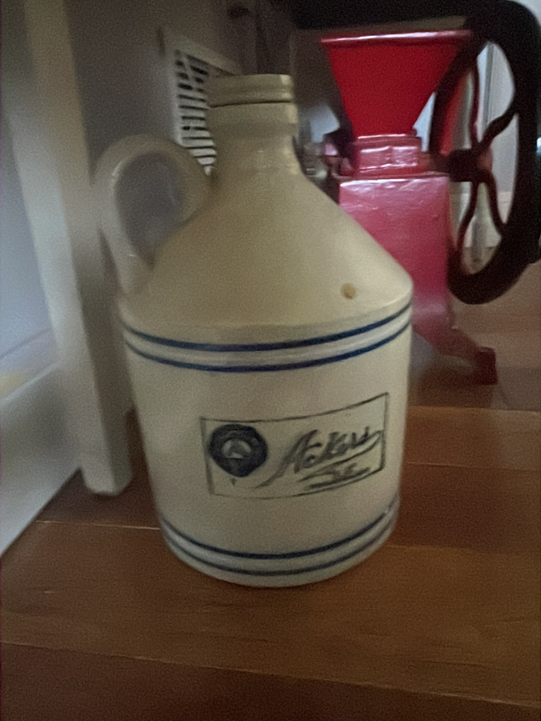 Stoneware jug with blue stripes by Finley, Ackers & Company