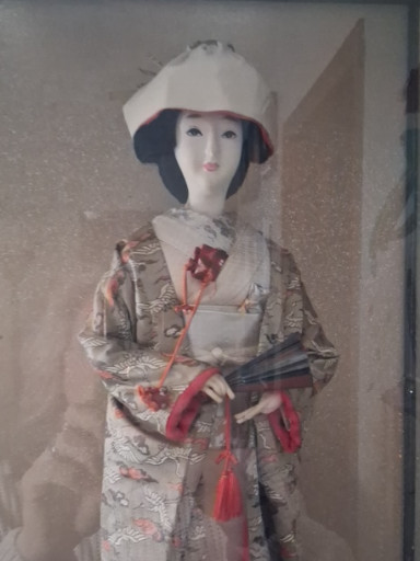 Vintage Japanese Geisha doll in silk kimono with traditional accessories