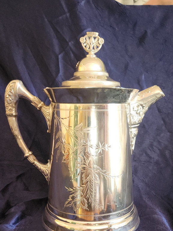 Triple silver-plated coffee pot with engraved floral design. Unknown maker.