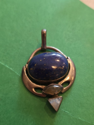 Sterling silver pendant with lapis lazuli cabochon and rock crystal accents