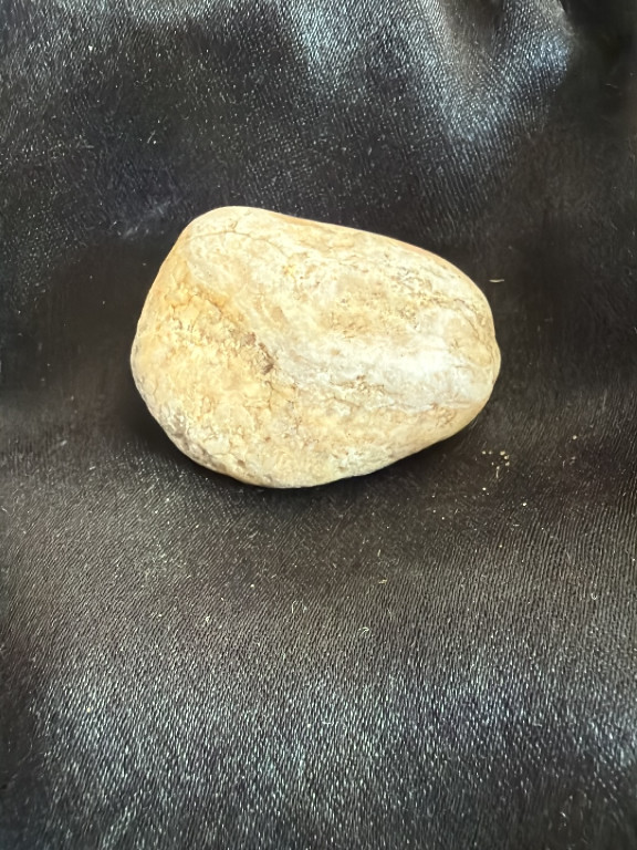 Natural stone, possibly a river-worn rock or geological specimen