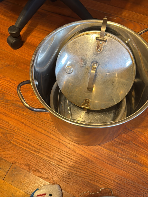 Stainless steel stock pot with steamer insert and lid