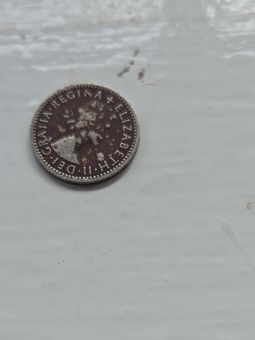 British sixpence coin (6d) from 1965 featuring Queen Elizabeth II