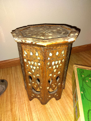 Wooden octagonal side table with mother-of-pearl inlay and carved fretwork panels