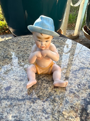 Bisque porcelain 'Piano Baby' figurine by Ardalt Lenwile