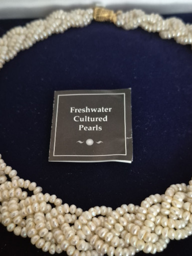 Multi-strand freshwater cultured pearl necklace with twisted design