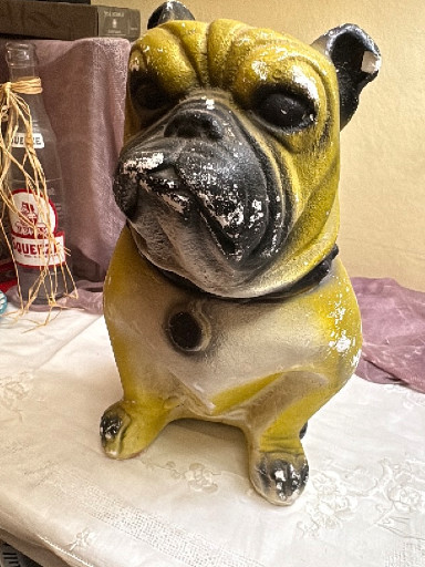 Chalkware figurine of a seated pug dog
