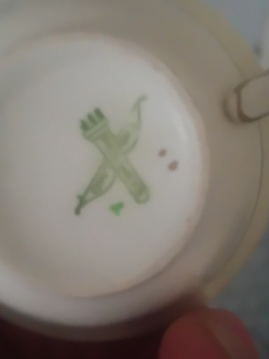 Porcelain item with green crossed swords mark