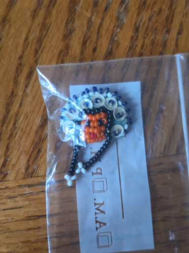 Native American seed bead figure pendant depicting a chief or kachina dancer