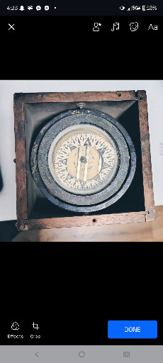 Antique nautical ship's compass titled 'Polaris Floating Oil Compass' in gimbaled wooden box