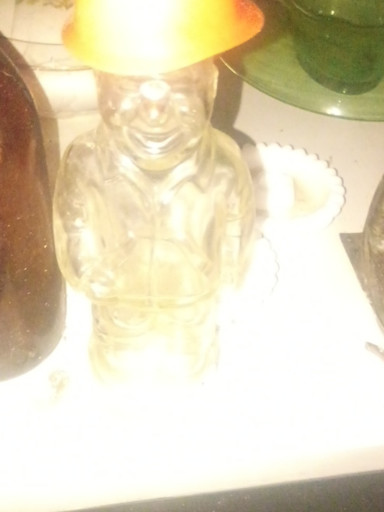 Glass figural aftershave decanter depicting a construction worker or laborer with removable cap