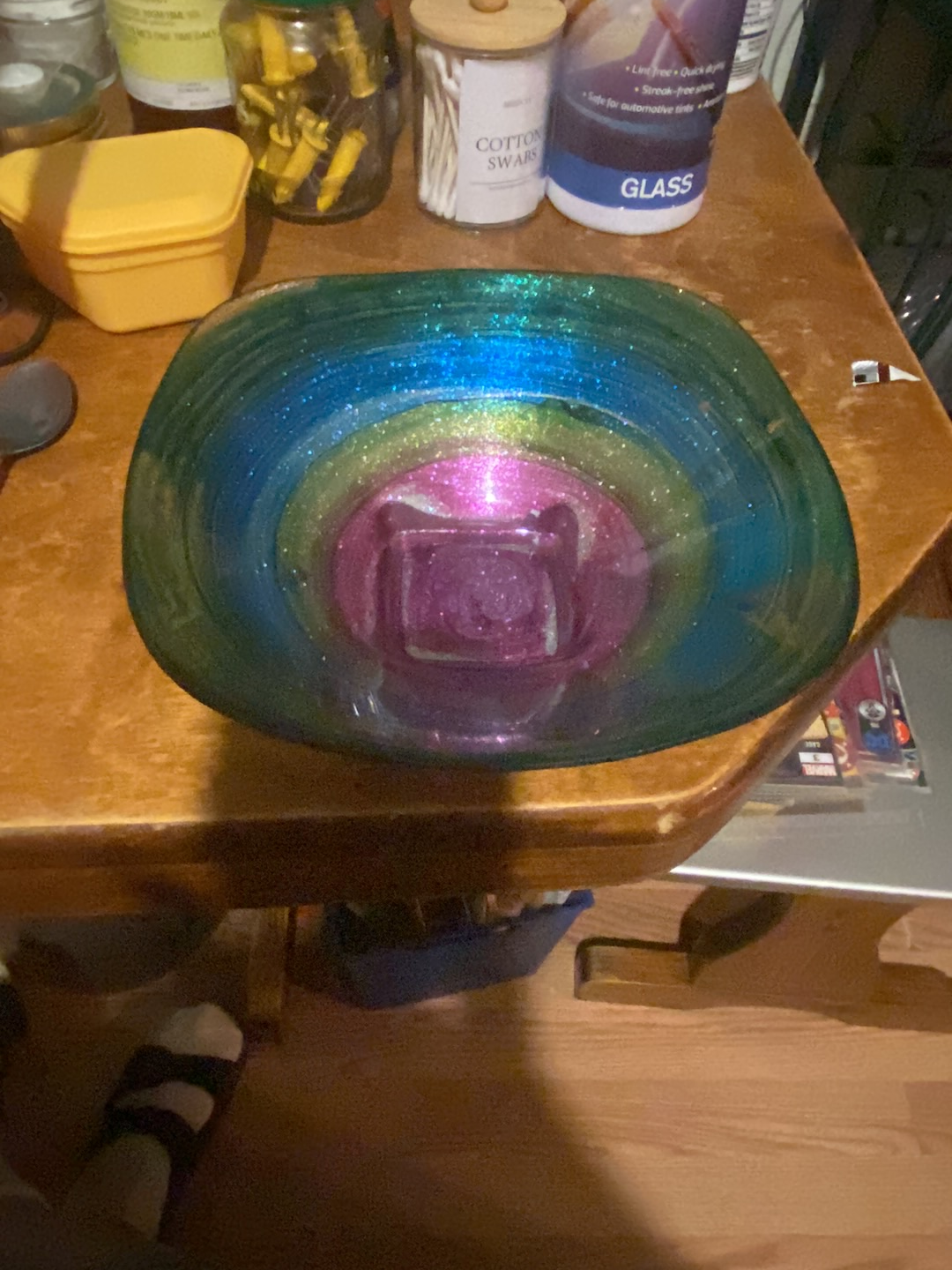 Art glass bowl with iridescent concentric rings in blue, green, and pink colors