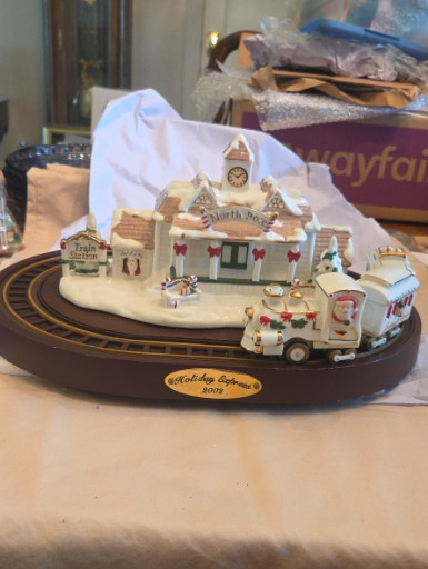 Porcelain collectible titled 'Holiday Express 2002' by Avon Gift Collection
