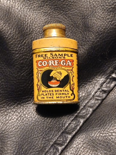Lithographed tin sample container for Wilson's CO-RE-GA denture adhesive powder