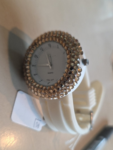 Fashion watch with rhinestone-embellished bezel and white silicone strap, Geneva brand