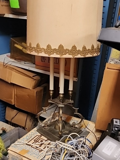Brass four-arm bouillotte table lamp with tole shade by Stiffel