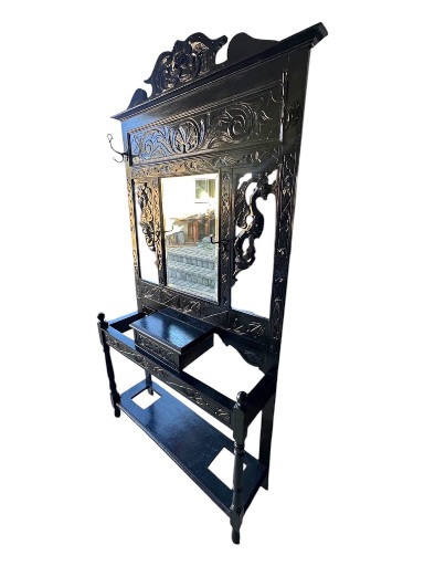 Carved oak hall stand with mirror and umbrella holders