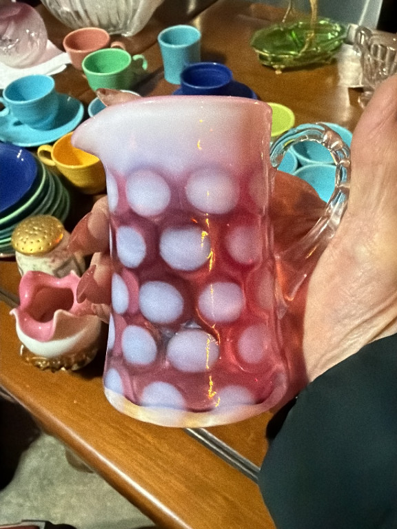 Cranberry opalescent glass creamer in Coin Dot pattern by Fenton