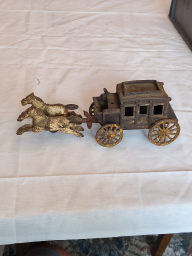 Cast iron toy stagecoach with two horses