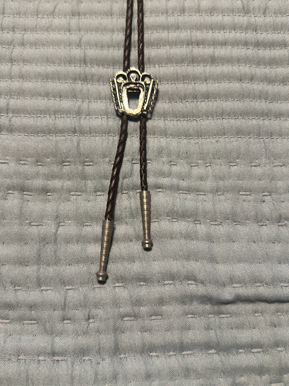 Metal bolo tie with crown design