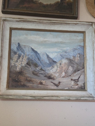 Oil painting depicting a mountainous desert landscape with rocky terrain and sparse vegetation
