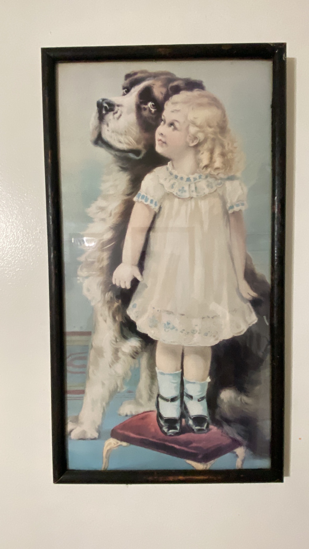 Print titled "Who's Biggest?" depicting a child with a Saint Bernard dog